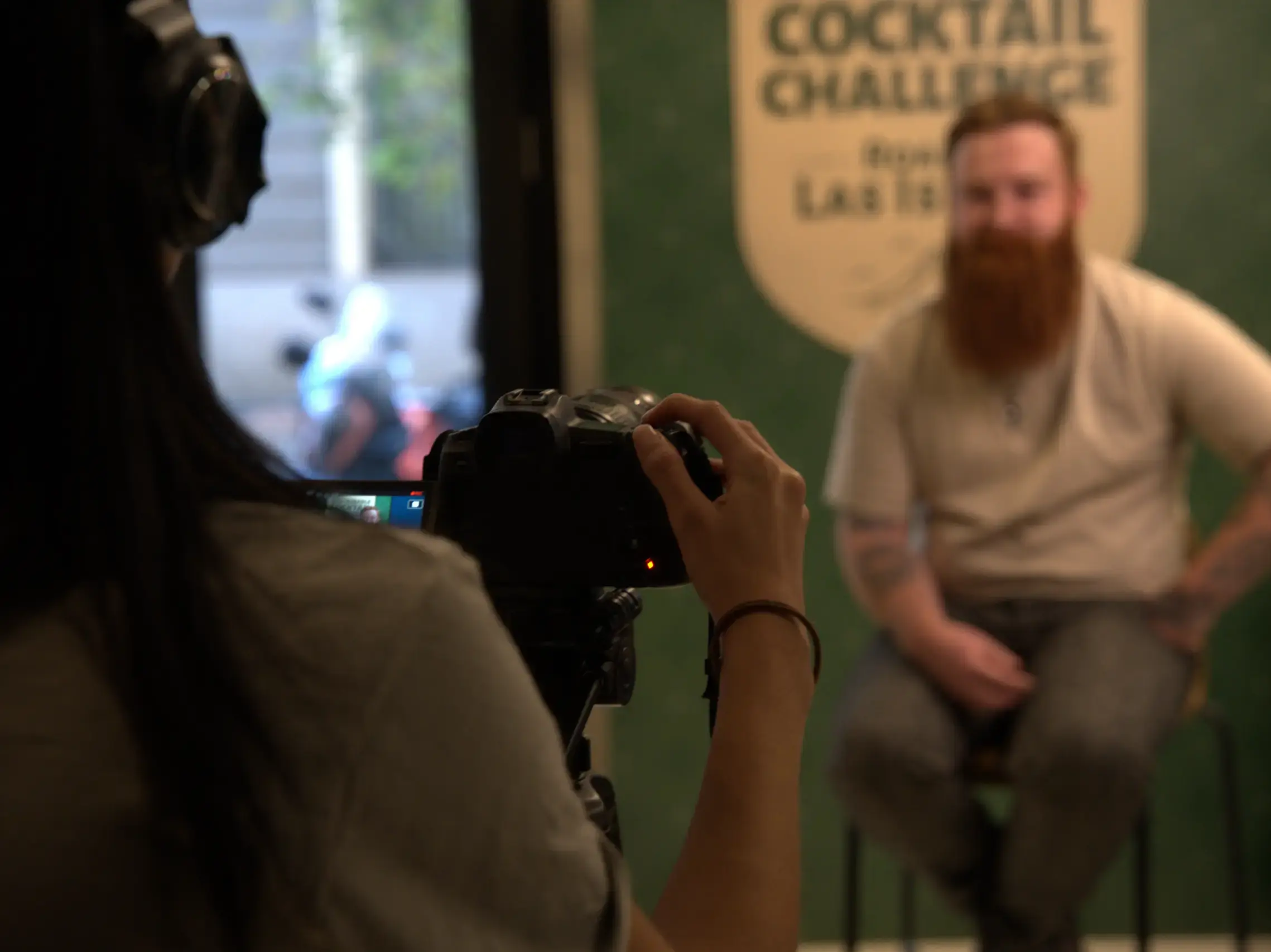 Event storytelling portfolio – AQ Productions Videographer filming an interview during an experiential event – AQ Productions portfolio.